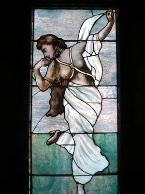 a stained glass window of a woman dancing at Waterfront Retreat Center in New Rochelle