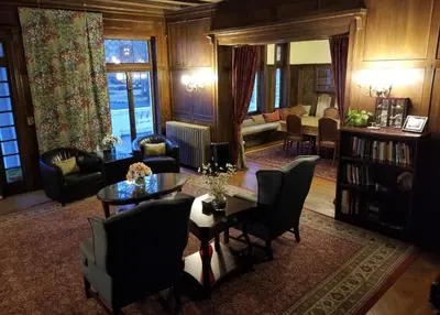 a living room with a table and chairs at Waterfront Retreat Center in New Rochelle