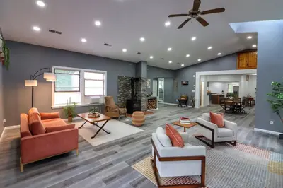a living room with furniture and a ceiling fan at Luxurious 3 Bedroom, 3 Bathroom, Entire Home in Catskill in Catskill