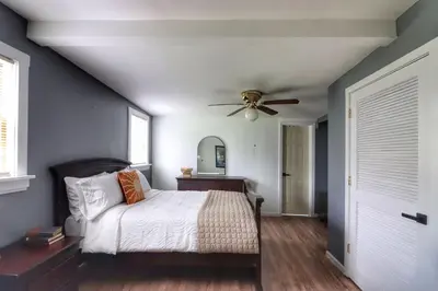 a bedroom with a bed and a ceiling fan at Luxurious 3 Bedroom, 3 Bathroom, Entire Home in Catskill in Catskill