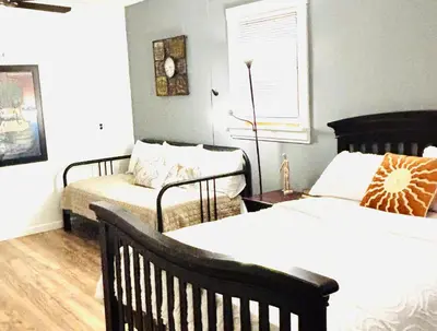 a bedroom with two beds and a window at Luxurious 3 Bedroom, 3 Bathroom, Entire Home in Catskill in Catskill