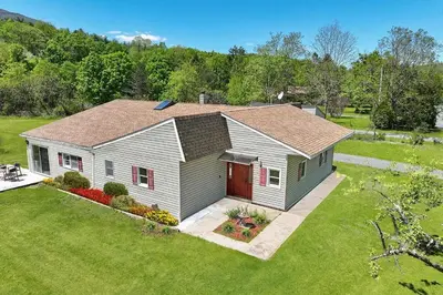 a house in a yard with a grass yard at Luxurious 3 Bedroom, 3 Bathroom, Entire Home in Catskill in Catskill