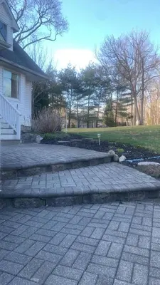 a brick walkway in front of a house at Beautiful Private Room Near Stony Brook University in Stony Brook