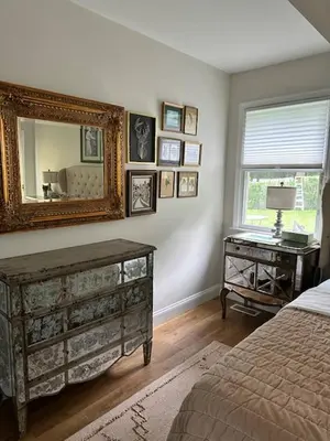 a bedroom with a bed and a mirror and a desk at Beautiful Private Room Near Stony Brook University in Stony Brook
