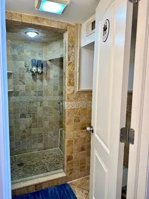 a bathroom with a shower with a glass door at BP STAYS - Hotel-Style, No Host, Professionally Managed ID247 in Jersey City