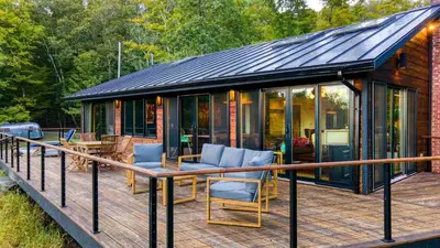 a screened in porch of a tiny house at Modern Catskills Escape w Open Living Steam Shower Hot Tub w Mountain Views Minutes from Woodstock Trails Suncliff Vista in Shokan