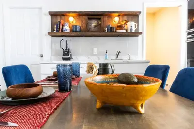 a kitchen with a table with a bowl on it at Private Classy 2nd Flr 3 Bed Apt Near Downtown in Torrington