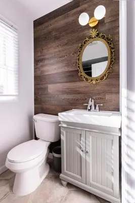 a bathroom with a white toilet and a mirror at Private Modern 1st Flr 3 Bed Apt Close to Downtown in Torrington