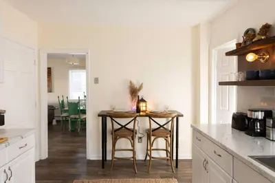 a kitchen with a table with a candle on it at Private Modern 1st Flr 3 Bed Apt Close to Downtown in Torrington