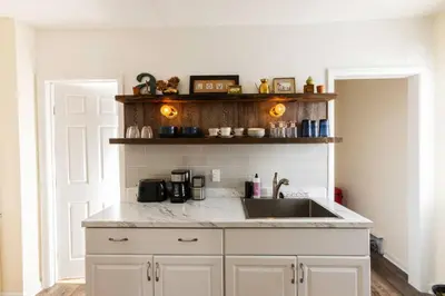 a kitchen with a sink and a counter at Private Modern 1st Flr 3 Bed Apt Close to Downtown in Torrington