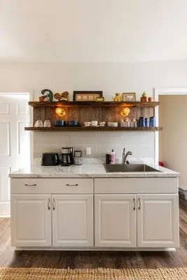 a kitchen with white cabinets and a sink at Private Modern 1st Flr 3 Bed Apt Close to Downtown in Torrington