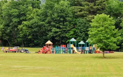 a park with a playground in a grass field at Cozy Mountain Dome Escape in the Catskills in Gilboa