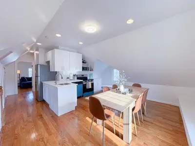 a kitchen and dining room with a table and chairs at Family-Friendly 4 Bed 3 Bath Downtown Delight in Stamford