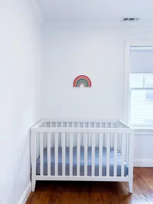 a white crib in a room with a window at Family-Friendly 4 Bed 3 Bath Downtown Delight in Stamford