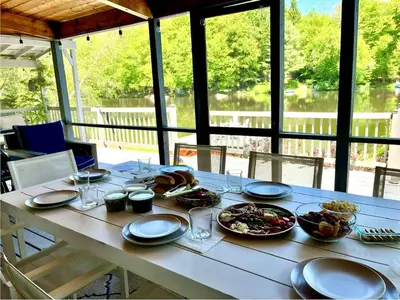 a white table with plates of food on it at Lake House, Fire Pit, Games Magnolia Lake House in Ferndale