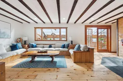 a living room with a couch and a table at The birch House Heated Pool, Sauna, Hot Tub & More in Dover