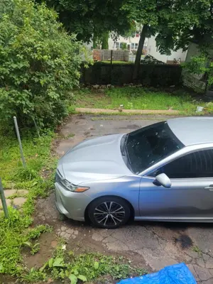 a silver car is parked in a driveway at 3 bedrooms fully finished in Middletown
