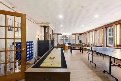 a room with ping pong tables and ping pong balls at Myrtle Villa 7BR Near Mount Snow with Indoor Heated Endless Style Pool Outdoor Hot Tub in Dover