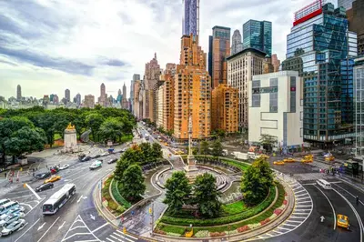 a city street with traffic in a city with tall buildings at Double Room at a shared Apartment near Times Square in New York