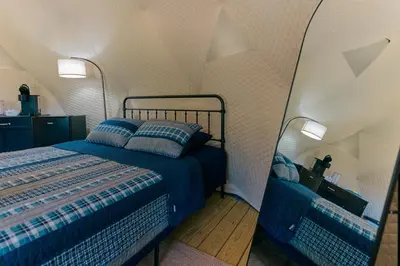 a bedroom with a bed in a tent at Boutique Glamping Dome in the Catskill Mountains in Gilboa
