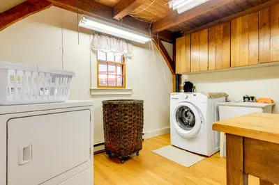a laundry room with a washer and dryer at 10 Mi to Mt Snow! Grand Estate Built to Entertain in Wilmington