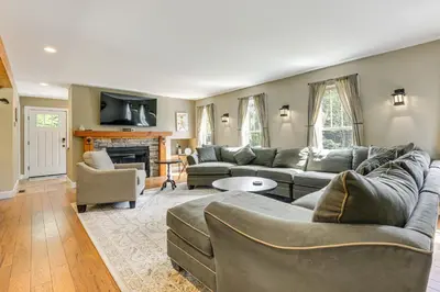 a living room with couches and a fireplace at 6 Mi to Mt Snow Grand Summit Resort Spacious Home in Wilmington