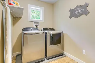 a laundry room with a washer and dryer at 6 Mi to Mt Snow Grand Summit Resort Spacious Home in Wilmington