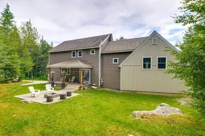 a large house with a yard with a house at 6 Mi to Mt Snow Grand Summit Resort Spacious Home in Wilmington