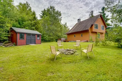a group of chairs sitting around a fire in a yard at Game Room, Hot Tub! Year-Round Dover Retreat in West Dover