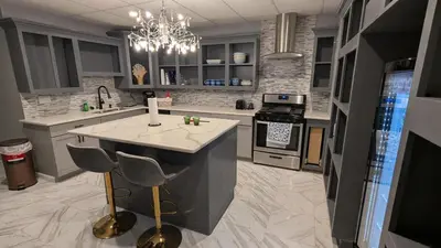 a kitchen with a island in the middle of it at 2 bedrooms with movie theater in Agawam