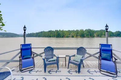 a group of four chairs and a table on a boat at Ski, Skate and Explore Ultimate Winter Getaway! in Averill Park