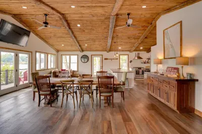 a kitchen and dining room with a table and chairs at Ski, Skate and Explore Ultimate Winter Getaway! in Averill Park