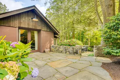 a stone patio in front of a small building at 15 Mi to Long Island Sound Bedford Winter Retreat in Bedford