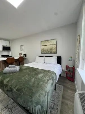 a bedroom with a large bed in a room at Yale Casa Baya in New Haven