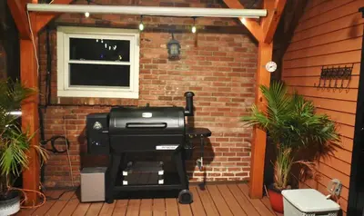 a grill on a patio with a brick wall at 3 Bed 2 Bath, Near UAlbany & MVP Arena, Private Driveway Parking in Albany