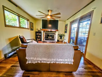 a living room with a couch and a fireplace at 3 Bed 2 Bath, Near UAlbany & MVP Arena, Private Driveway Parking in Albany