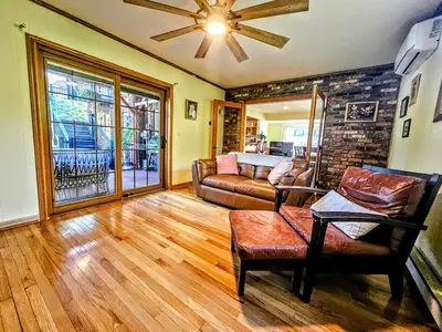 a living room with a couch and a table at 3 Bed 2 Bath, Near UAlbany & MVP Arena, Private Driveway Parking in Albany