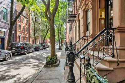 a city street with cars parked on the street at Spacious SoHo 1Bedroom Unit Washer & Dryer in New York