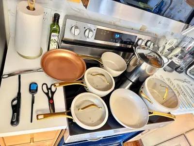 a bunch of pots and pans sitting on top of a stove at Modern Home - Privacy - Prime Location - 18min Camelback Ski Resort in Tobyhanna