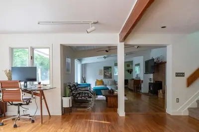 a living room with a table and chairs at Gunn Brook Mountain House in Cornwall