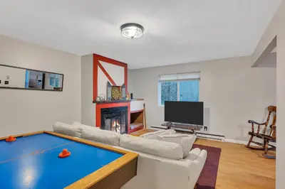 a living room with a pool table in it at Luxury Mountain Getaway - 6 bed, 3 bath, hot-tub, fire-pit, game-room in Hunter