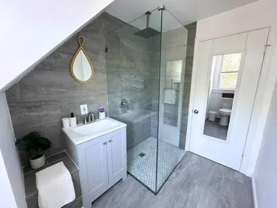 a bathroom with a sink and a shower at The Nest At Elm City Flats in New Haven