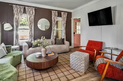 a living room with a couch and a table at Hudson Valley Hot Tub Sauna Fire Pit Games in Hudson
