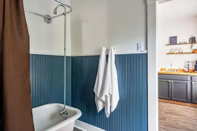 a bathroom with a bath tub and a sink at Hudson Valley Hot Tub Sauna Fire Pit Games in Hudson