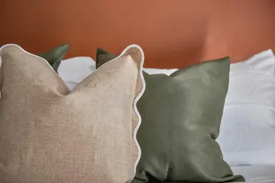 two pillows sitting on top of a bed at Hudson Valley Hot Tub Sauna Fire Pit Games in Hudson