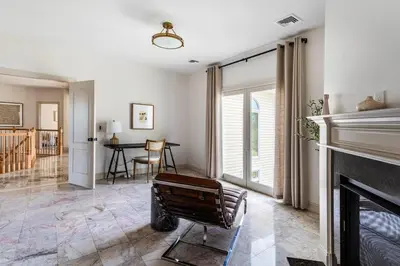 a living room with a fireplace and a table at Rhinebrook Estate 8 Bed 11 Bath Sleeps 20 in Hyde Park