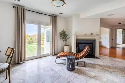 a living room with a couch and a fireplace at Rhinebrook Estate 8 Bed 11 Bath Sleeps 20 in Hyde Park