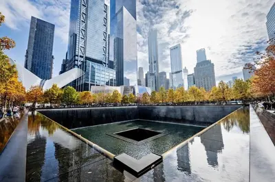 a fountain in a park with a city in the background at 20 minutes to Central Park Manhattan New York City 16 mins Metlife stadium in West New York