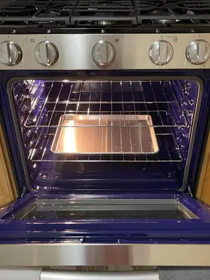 an oven with a pan inside of it at Cozy 2 Bedrooms 1and half Bathrooms Near Prudential with Parking Entire Apartment in Newark