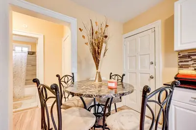a dining room with a table and chairs at Convenient Hartford Condo Less Than 2 Mi to Dtwn! in Hartford